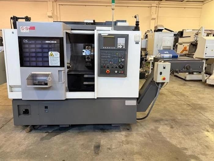 Токарный станок с ЧПУ Hwacheon CUTEX 160 б/у с устройством подачи прутка-ID17151