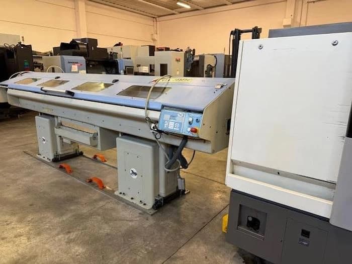 Токарный станок с ЧПУ Hwacheon CUTEX 160 б/у с устройством подачи прутка-ID17151