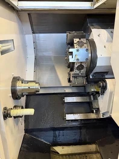 Токарный станок с ЧПУ Hwacheon CUTEX 160 б/у с устройством подачи прутка-ID17151